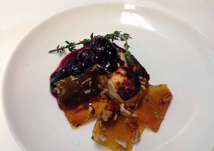 Roasted feta with Cava, thyme, blueberry compote and glass candy with toasted fennel and pecans