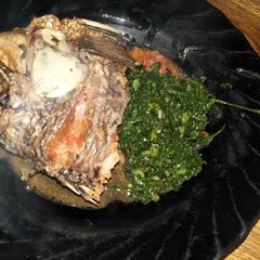 A picture of Stewed fish and greens.