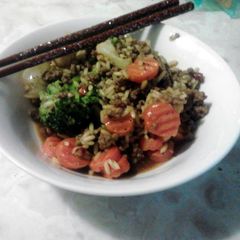 A picture of spicey rice with beans and vegtables.