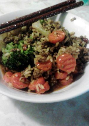 A picture of spicey rice with beans and vegtables.