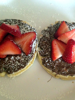 A picture of Nutella Waffle With Strawberries.