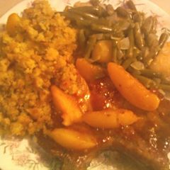 A picture of Peach Glazed Pork Chops with Cornbread Stuffing.