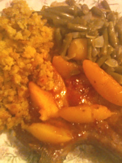 A picture of Peach Glazed Pork Chops with Cornbread Stuffing.
