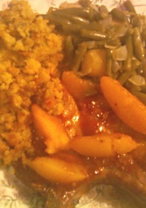 A picture of Peach Glazed Pork Chops with Cornbread Stuffing.
