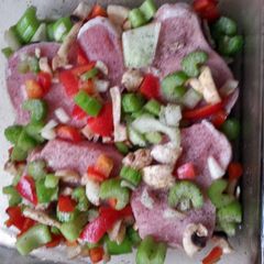 A picture of easy pork chops and veggies in a pan.