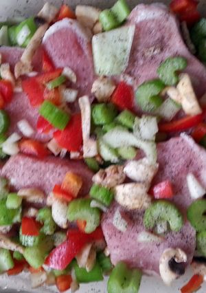 A picture of easy pork chops and veggies in a pan.