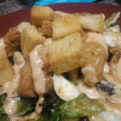 A picture of Hot and spicy chicken tenders with tangy sweet salad.