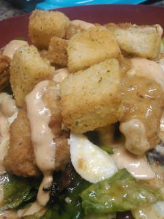A picture of Hot and spicy chicken tenders with tangy sweet salad.