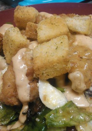 A picture of Hot and spicy chicken tenders with tangy sweet salad.