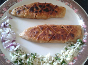 A picture of Onion Cheese Stuffed Fish Shaped Paratha.