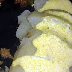 papa a la huancaina (peruvian potatoes with a curry cheese sauce A picture of papa a la huancaina (peruvian potatoes with a curry cheese sauce.