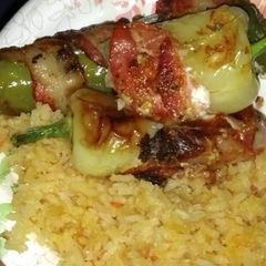 A picture of Bacon Wrapped Sausage & Cheese Stuffed Green Chiles.
