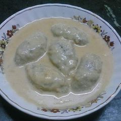 A picture of Ranga alur dudh puli(sweet potato dumplings).