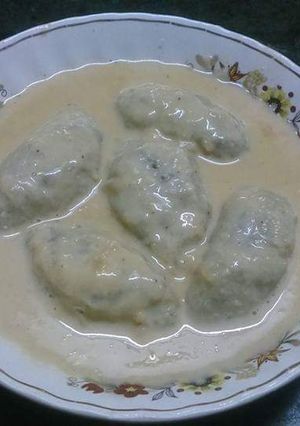 A picture of Ranga alur dudh puli(sweet potato dumplings).