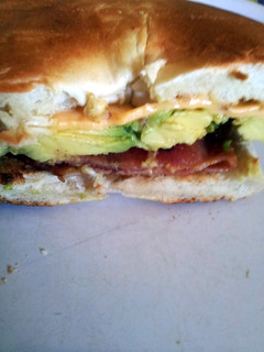 A picture of Avocado, bacon and chedder cheese bagel.