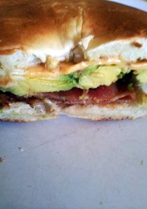 A picture of Avocado, bacon and chedder cheese bagel.