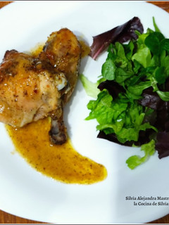 Una foto de Muslos de pollo al horno
