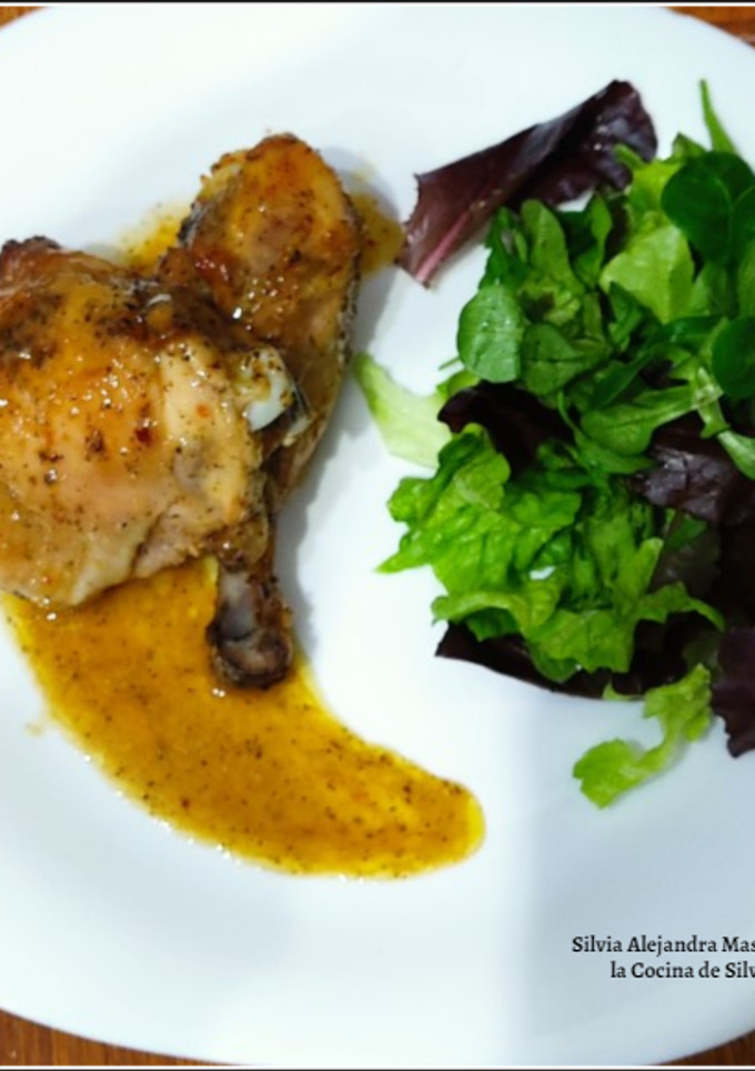 Una foto de Muslos de pollo al horno