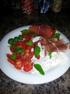 A picture of Caprese Salad w Sicilian Olives & Prosciutto.