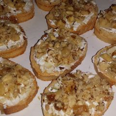 A picture of Goat cheese and walnut crostini.