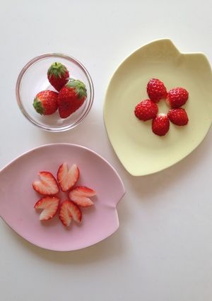 A picture of Sakura and Plum Flowers with Just 3 Strawberries.