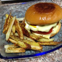 A picture of Extra Cheese Burger And Home Made Fries.