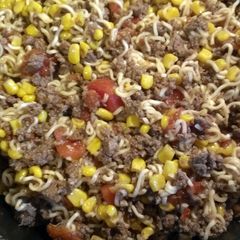 A picture of ground beef curly noodles.