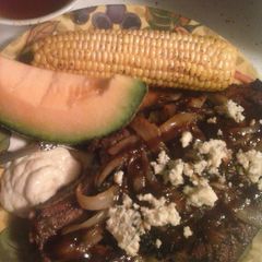 A picture of Brad's grilled rib eye steak.