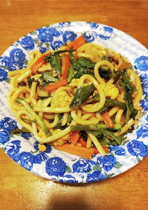 A picture of Yaki Udon Set with Sauce and Chrysanthemum Greens.