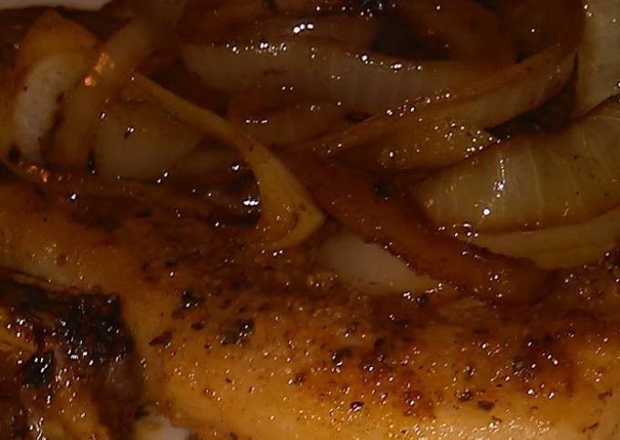 Seared pork chop with onions