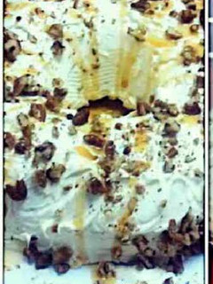 A picture of Butter Pecan Cake with Cream Cheese Icing & Caramel Drizzle.