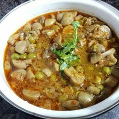 A picture of Mushroom peas curry.
