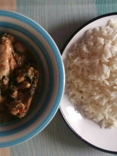 A picture of Rice with chicken pepper soup.