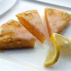 A picture of Lemon Brownies Topped with Lemon Icing Glaze.