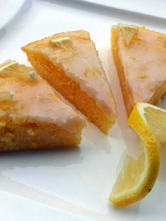A picture of Lemon Brownies Topped with Lemon Icing Glaze.