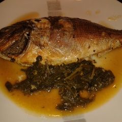 Sea Bass with spinach and white wine A picture of Sea Bass with spinach and white wine.