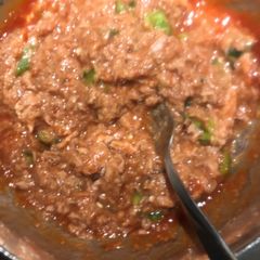 A picture of Tuna fish cocktail sauce or crabmeat.