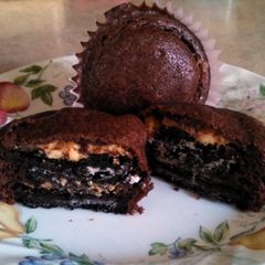 A picture of Brownie cupcakes with peanut butter Oreo centers.
