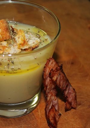 A picture of POTATO & LEEK SOUP with CRISPY PROSCIUTTO & CROUTONS.