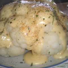 A picture of Cheese Sauce over Cauliflower.