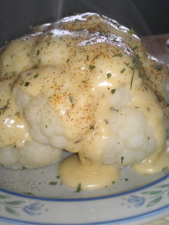 A picture of Cheese Sauce over Cauliflower.