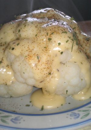 A picture of Cheese Sauce over Cauliflower.