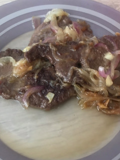 Una foto de Hígado encebollado