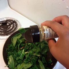 A picture of Saute Kale& Spinach with crab meat.