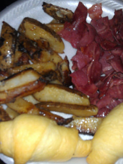 A picture of bacon and home fries.