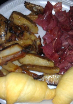A picture of bacon and home fries.