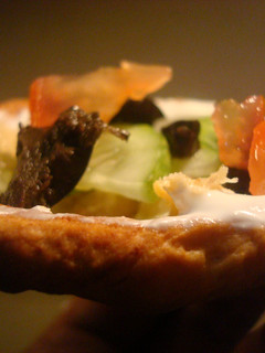 A picture of Seven layer dip in bread bowls.