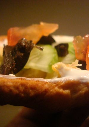 A picture of Seven layer dip in bread bowls.