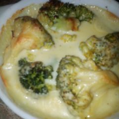 A picture of Broccoli in cheese sauce.