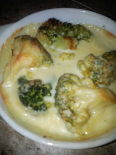 A picture of Broccoli in cheese sauce.